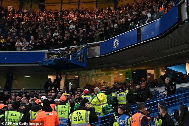 Fans applauded as the person was taken out of the stadium following his shocking first-half accident