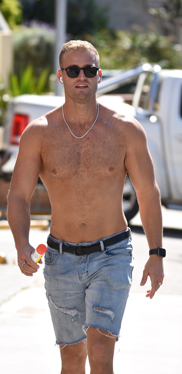 Tim, 31, made sure his well-developed physique was on display as he took charge in a simple pair of denim cut-offs.  He completed his look with designer sunglasses and a statement necklace around his neck