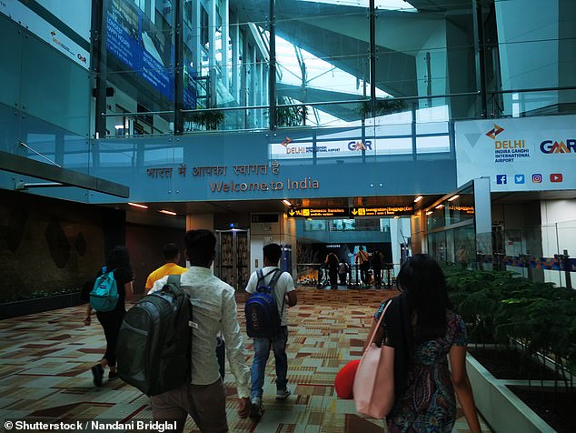 Some functions will be moved to companies in India and the Philippines.  A 'Welcome to India' sign is pictured at the Indira Gandhi International Airport in New Delhi