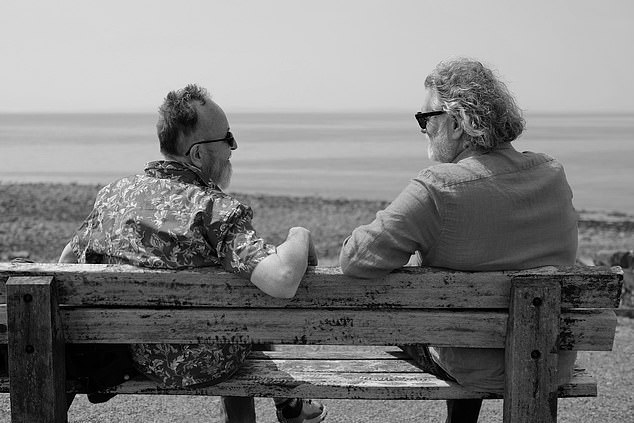 He also shared this black and white photo of himself sitting on a bench with Dave