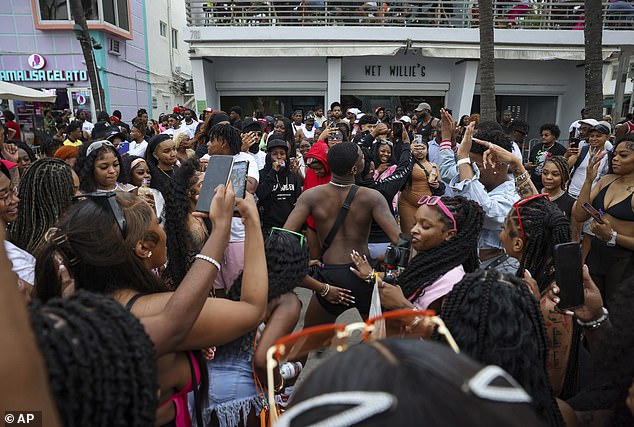 The Miami Beach City Commission announced earlier this month that new rules will allow the city to impose curfews and beach closures if necessary.  Pictured: A crowd of spring breakers on Ocean Drive in Miami Beach on March 19, 2023