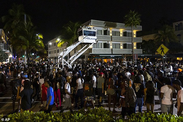 Visitors and residents can expect a significant police presence and robust enforcement of open container and noise laws during the peak spring break season in mid-March.  In the photo: crowds in Miami Beach after the two fatal shootings