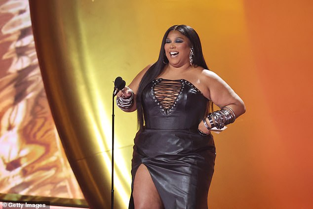 Platinum singer Lizzo made a rare public appearance at the Grammys Sunday, presenting an award to thousands in person and millions on TV, just six months after a sexual harassment lawsuit was filed against her