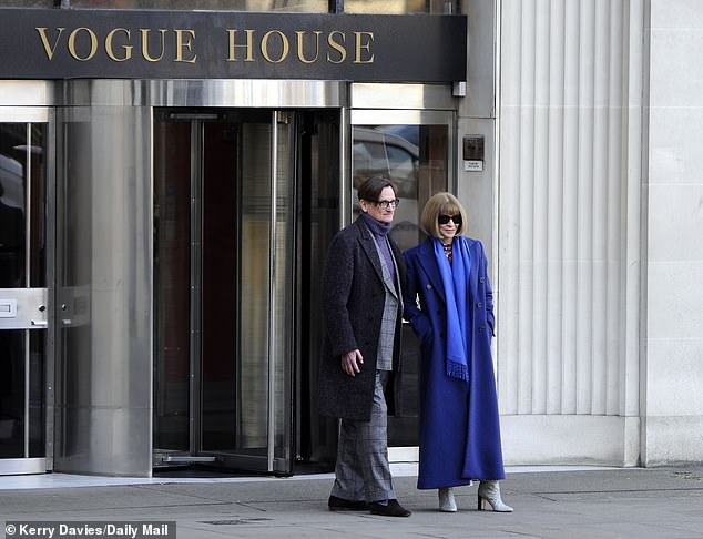 When she arrived at Condé Nast's London headquarters, Wintour sported her signature coiffed bob and sunglasses and wore a royal blue coat.