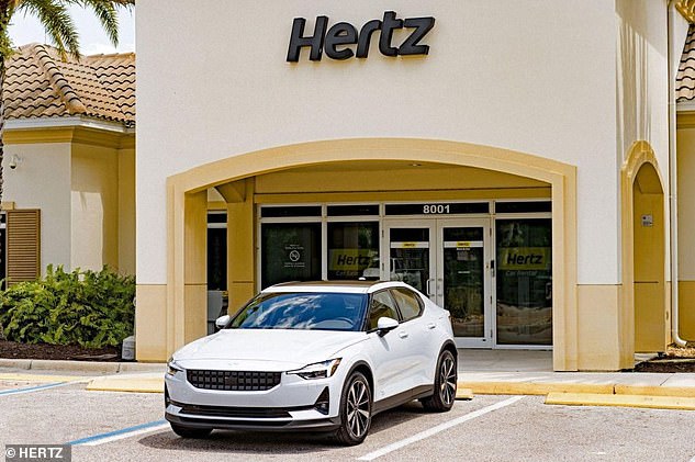 Rental company Hertz has backtracked on plans to buy 50,000 electric cars from EV maker Polestar.  Pictured is a Polestar vehicle outside a rental office