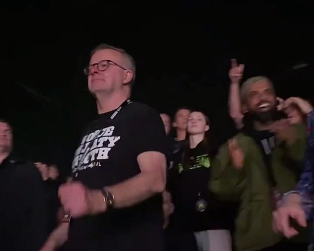 Mr. Albanese is known to enjoy live music and has said in the past that Swift's concerts are unmissable (Mr. Albanese is pictured dancing at a Midnight Oil concert)