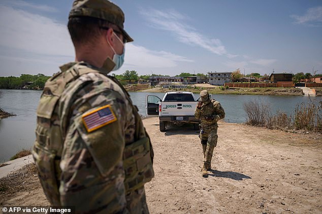 At least 12 gunmen have been killed by the Mexican military in a gun battle in Mexico near the U.S. border, officials said.  Border patrol agents stand in front of the Rio Grande River and a suburb of the Mexican city of Ciudad Miguel Aleman