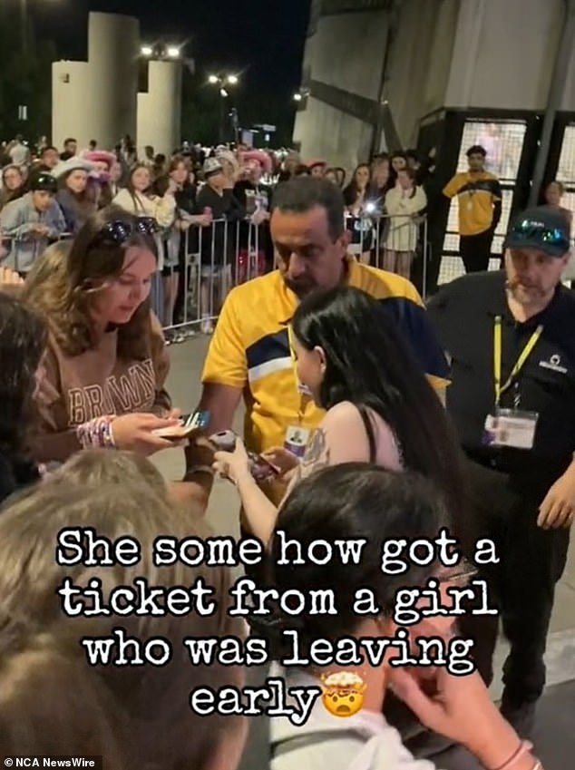 The short clip shows stunned fans as the concertgoer sends the card to the fan, before they hug and the woman runs into the venue