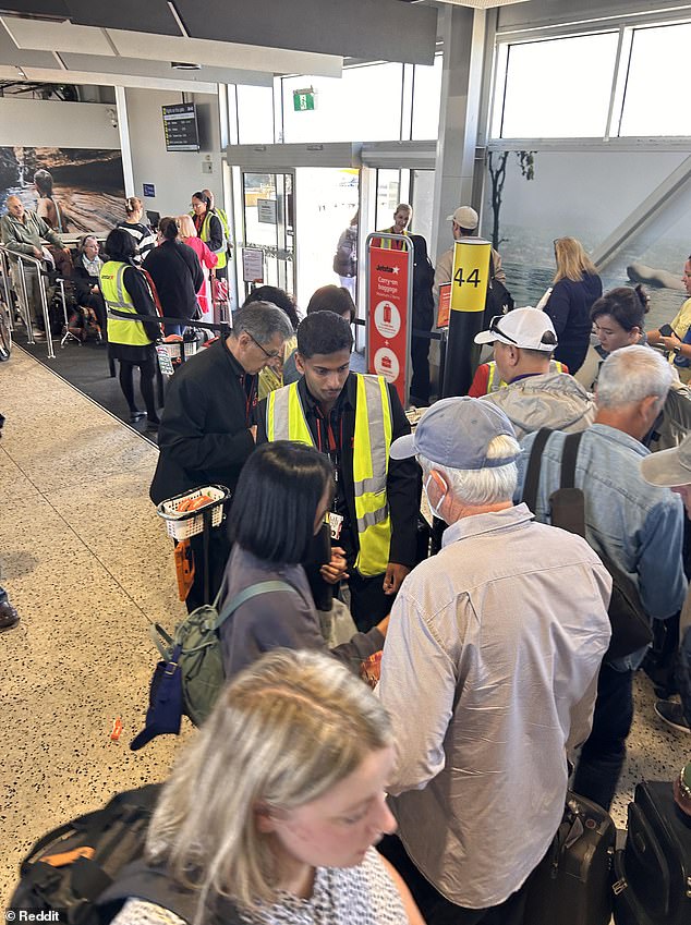 A lesser-known travel hack has been revealed to avoid astronomical baggage fees for carry-on bags at the airport (Photo: Airline staff weighing passengers' bags)