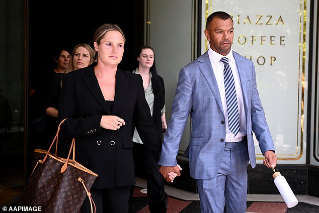 Kurtley Beale and wife Maddi leave during a break in proceedings at Sydney's Downing Center District Court