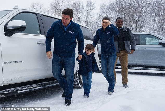 DeSantis is seen in Iowa with his wife Casey and son Mason on the campaign trail on January 12