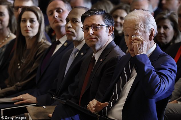 President Joe Biden wipes away a tear as he listens to Italian tenor Andrea Bocelli sing 'Amazing Grace'