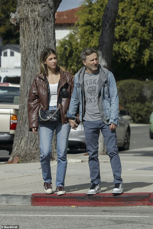 Bob Saget's widow Kelly Rizzo and her new boyfriend Breckin Meyer were spotted holding hands while taking a walk in Los Angeles, California on Friday afternoon