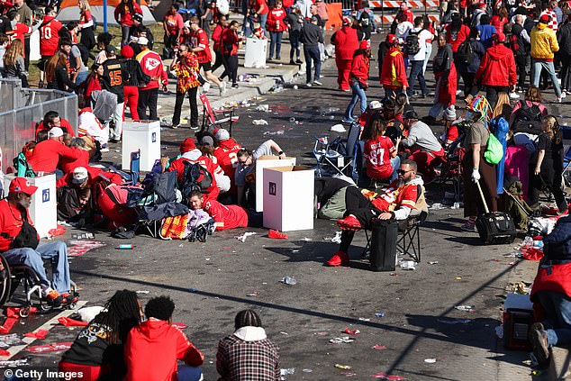 In the aftermath of a bloody shooting that left one dead and at least 22 injured, a Kansas City Chiefs fan was spotted calmly among the exhausted crowd.