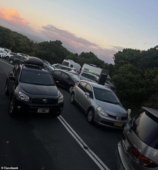 Furious residents have lashed out at tourists who parked their cars on a main road (pictured) so they could watch the sunrise at Cape Byron Lighthouse