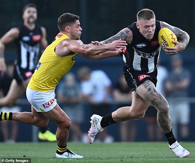 Footy fans demand answers after Collingwood and Richmond played at Princes Park - home of Carlton - in a pre-season AFL match (pictured, Magpies star Jordan De Goey)