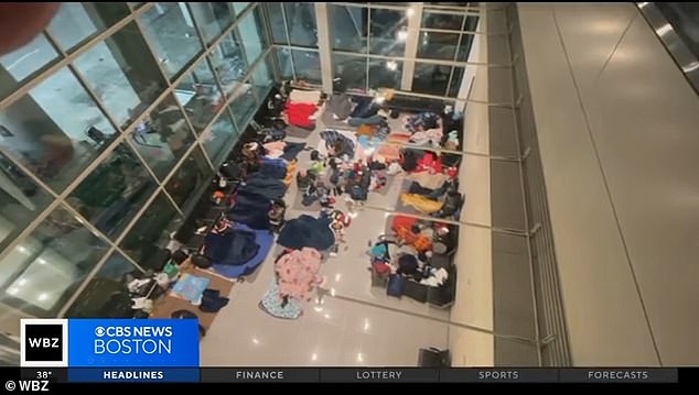 Migrants are seen sleeping in at Boston's Logan Airport, in the international terminal