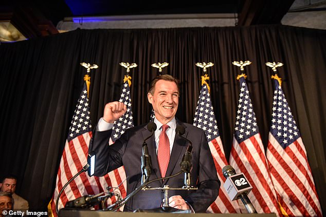 Democrat Tom Suozzi, who previously represented New York's Third District for three terms, celebrates his victory in the special election on Tuesday evening