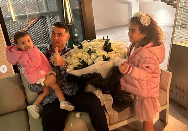 Another photo showed Ronaldo holding a large bouquet of flowers he had received