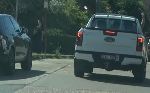 The occupants of a white ute with a P-plate were filmed hurling water bomb balloons at pedestrians and other road users