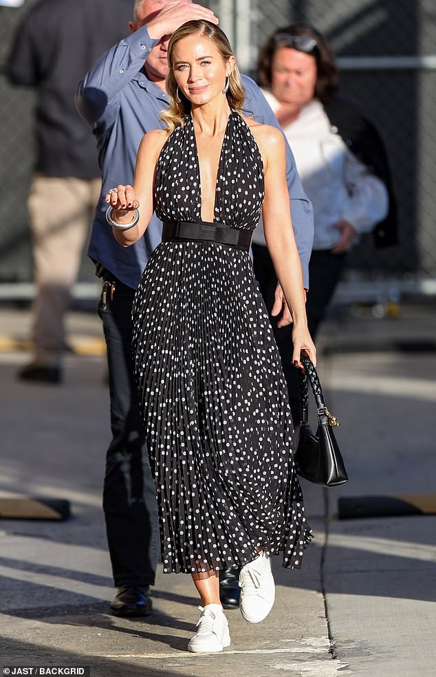 The 40-year-old actress looked ravishing in a plunging black dress with white polka dots all over