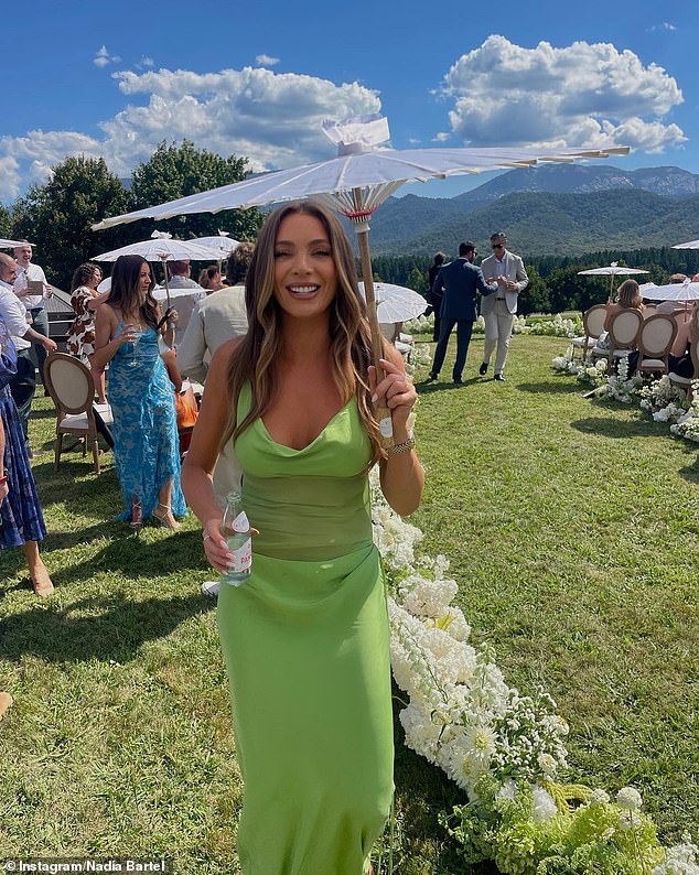 The 38-year-old fashionista shared a series of photos from the reception on Instagram on Sunday.  Wearing a neon green dress with a plunging neckline and a sheer midriff, the mother of two worked her angles in the sun, while shading herself with an elegant parasol