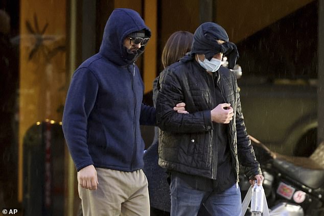 Former FBI informant Alexander Smirnov, left, leaves his law office in downtown Las Vegas after being released from federal custody Tuesday, February 20.