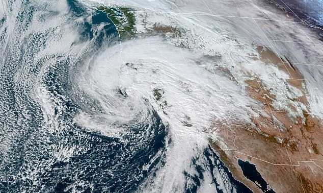 The second of consecutive atmospheric rivers battered California on Sunday, prompting the first-ever hurricane winds warning in state history