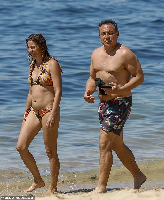 TV funnyman Sam Pang, 40, showed off his guns in festive board shorts as he hit the beach on the Mornington Peninsula with bikini-clad wife Adriana Pesavento (left) and their daughter Sienna last month