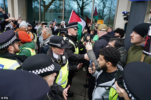 A man appeared to be arguing with police as the procession became unruly at Hyde Park Corner