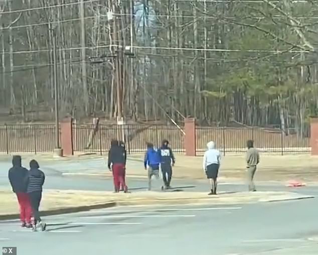 Authorities say two people were shot and suffered non-life-threatening injuries after the incident at McEachern High School, 22 miles northwest of Atlanta.