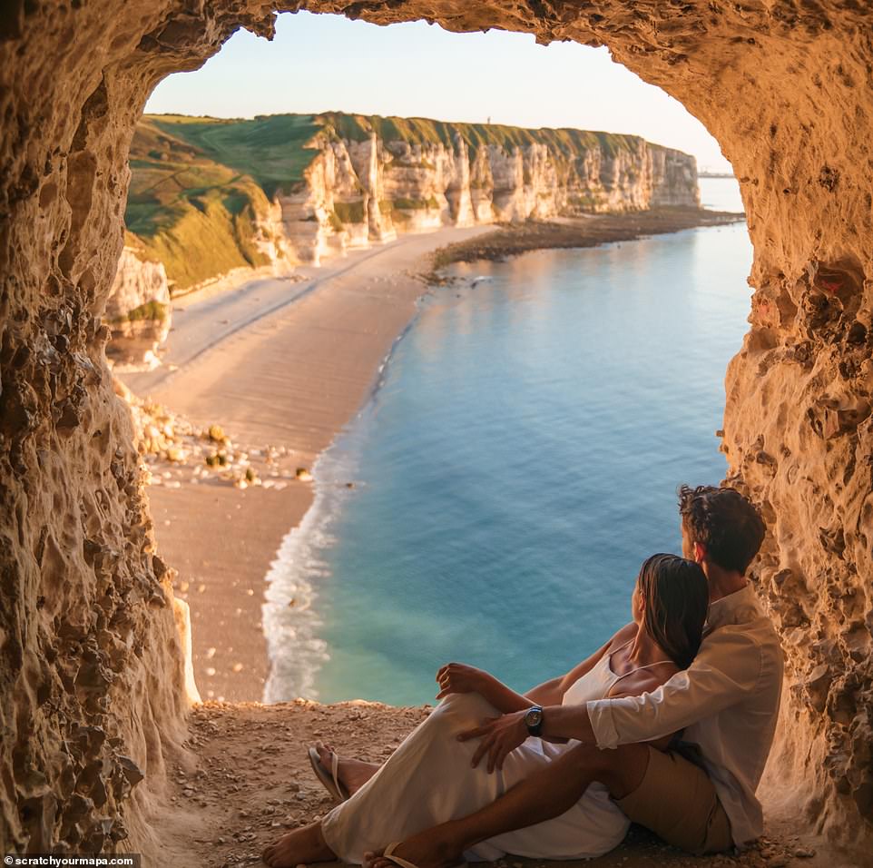 World-traveling couple Danielle Zito and Fede Supital Terron have allowed MailOnline Travel to capture 15 incredible photos of their adventures.  They are pictured above overlooking the striking rock formations in Étretat, a town in Normandy, France