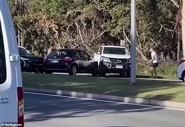 A 23-year-old man has been charged with a string of offenses after allegedly chasing men with a knife following a road rage incident on the Gold Coast on Saturday (pictured)