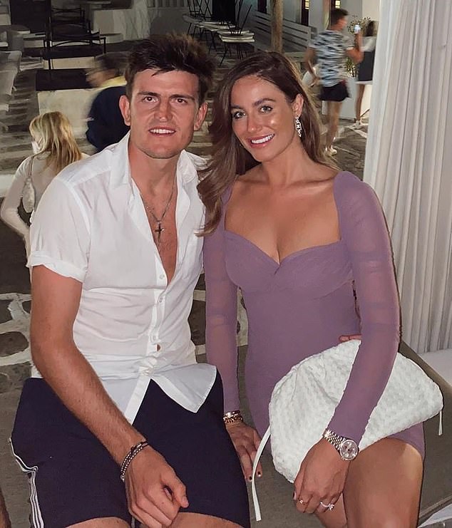 Here the footballer is seen with his wife Fern Hawkins on holiday in Mykonos