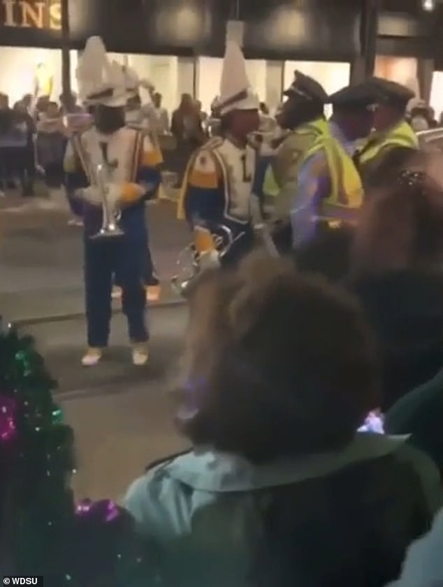 During a break during the march, video shows a New Orleans Police Department officer apparently elbowing the student, who was standing right next to him at the time.