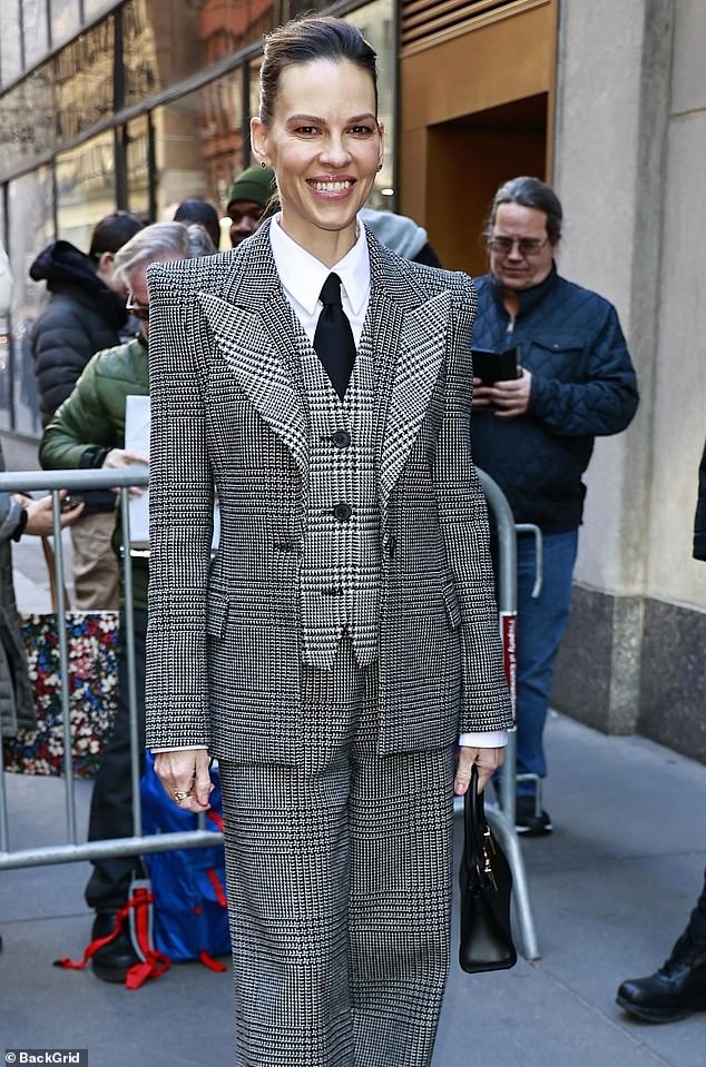 The 49-year-old actress smiled as she donned a three-piece pantsuit with a sleek-looking and form-fitting jacket, which was paired with matching trousers.