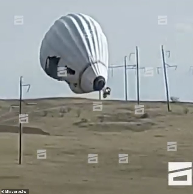 You can see the balloon floating close to the hill before it connects to a power line, with the flames in the basket area quickly intensifying