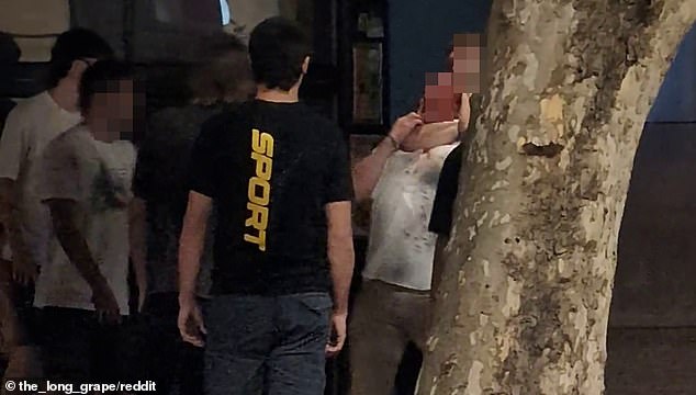 The video shows an alleged attack on York St in Sydney.  A group of young people were seen fighting with an elderly person before someone pushed him and another grabbed him from behind