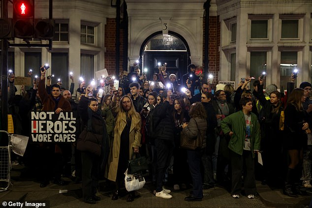 Hundreds of people have marched on the Russian embassy in London following the death of Vladimir Putin's opponent Alexei Navalny.