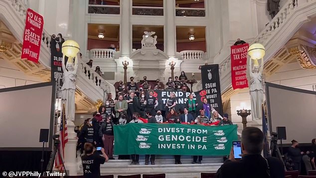 Protesters blocked the steps in the Capitol's main rotunda and held banners calling on the state to 'move away from genocide'