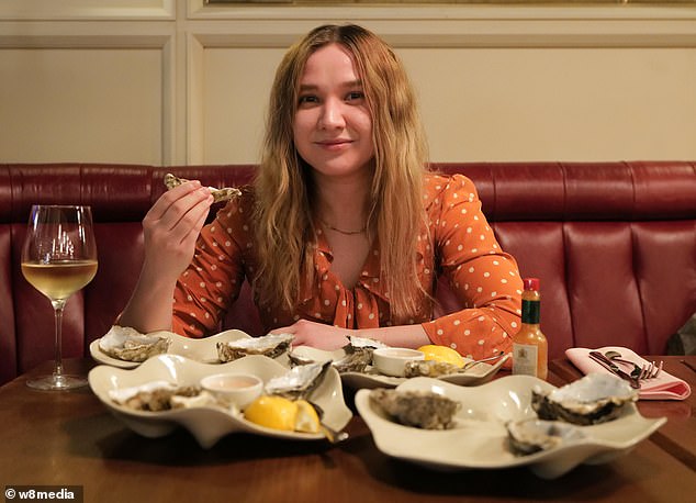 Elmira, 26, pictured, ate 48 oysters in an attempt to channel Georgia's viral 'Oyster Girl' EquanaB