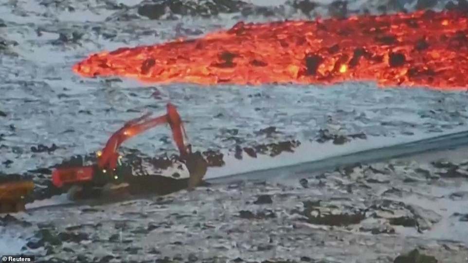 A work crew riding in what appears to be an excavator makes their escape unnervingly close, with flaming hot orange lava right on their tail