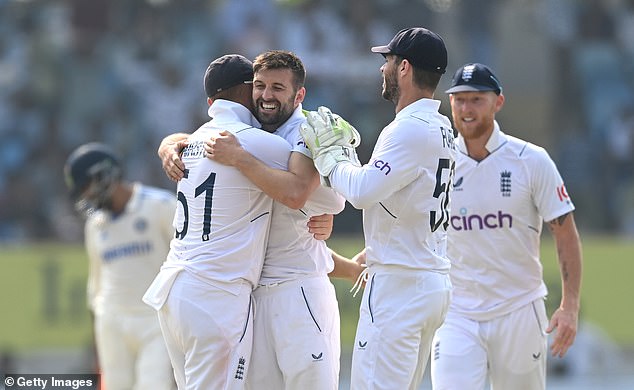 Mark Wood (second from left) was delighted when he finally dismissed Rohit Sharma on the first day