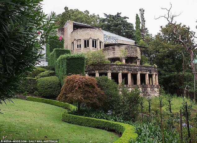 A once-grand stone mansion on Sydney's North Shore, made famous by TikTokers as a 'haunted house', has hit the market for a whopping $10 million.  Pictured: the remains of 'Morella', which was built on the Mosman waterfront in 1939