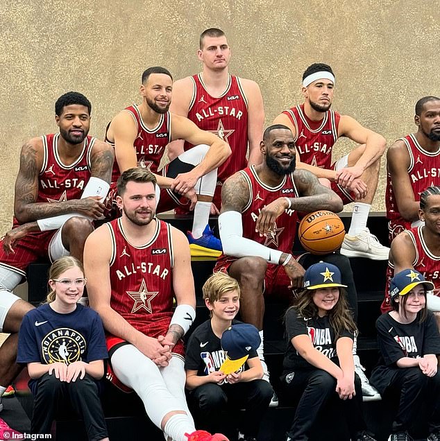 The little boy was grinning from ear to ear as he sat between Luka Doncic and LeBron James during his photo op with the players