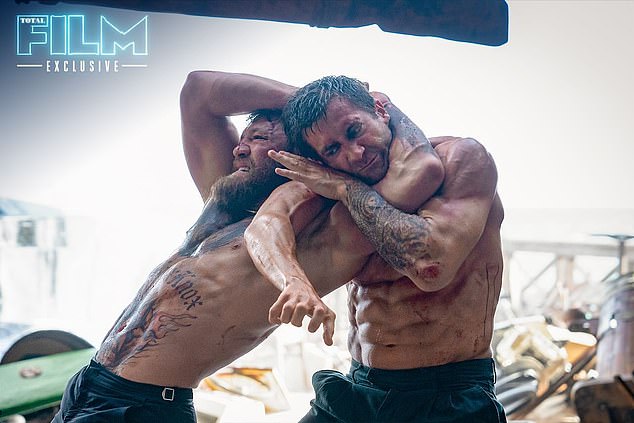Jake Gyllenhaal showed off his ripped physique as he wrestled Conor McGregor in new footage from his '80s remake of Road House