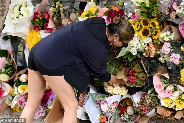 Dozens of bunches of sunflowers, roses, dahlias, chrysanthemums and tulips are now attached to the property's iron gates in a tribute reminiscent of the mounds of flowers left in public places after Princess Diana's death.