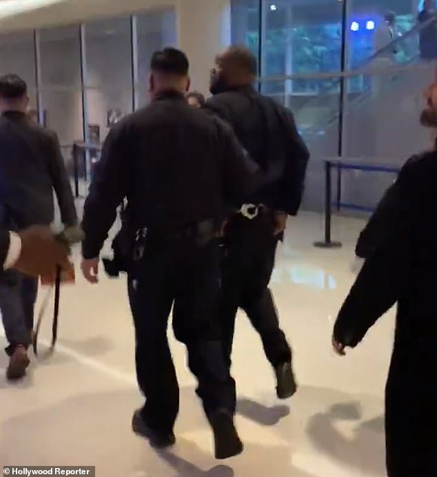 The 48-year-old musician and activist, real name Michael Render, was led away from the Grammys in handcuffs following a 'physical altercation' after winning three awards