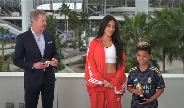 Kim Kardashian wore a white crop top and Adidas tracksuit, while her son, Saint, wore a Real Madrid jersey while making surprise appearances on Fox Sports on Sunday