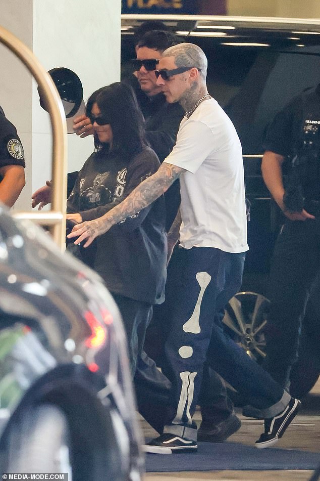 Kourtney Kardashian and Travis Barker cut casual figures as they